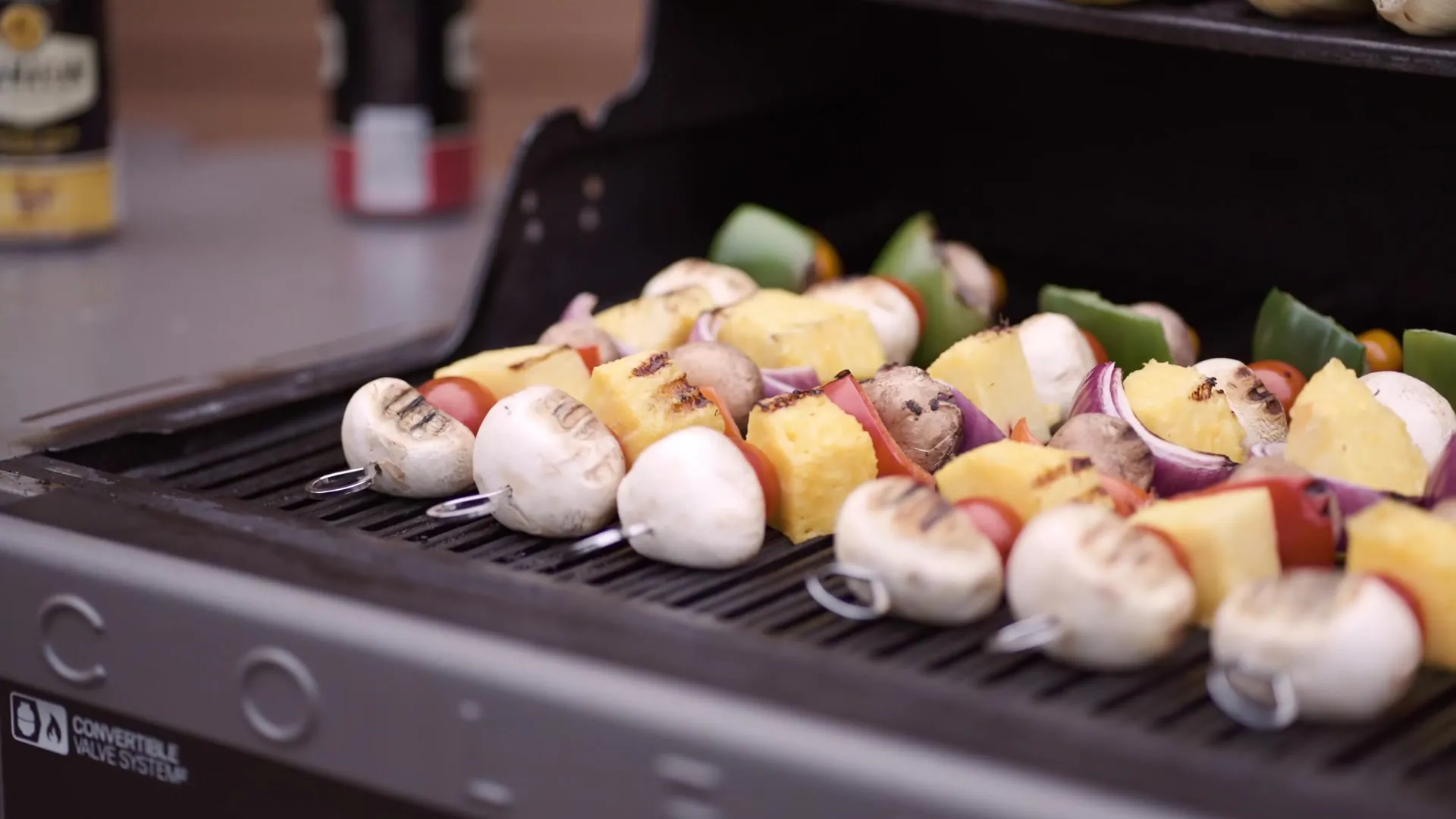 Vegetable and chicken skewers on the shared barbecue