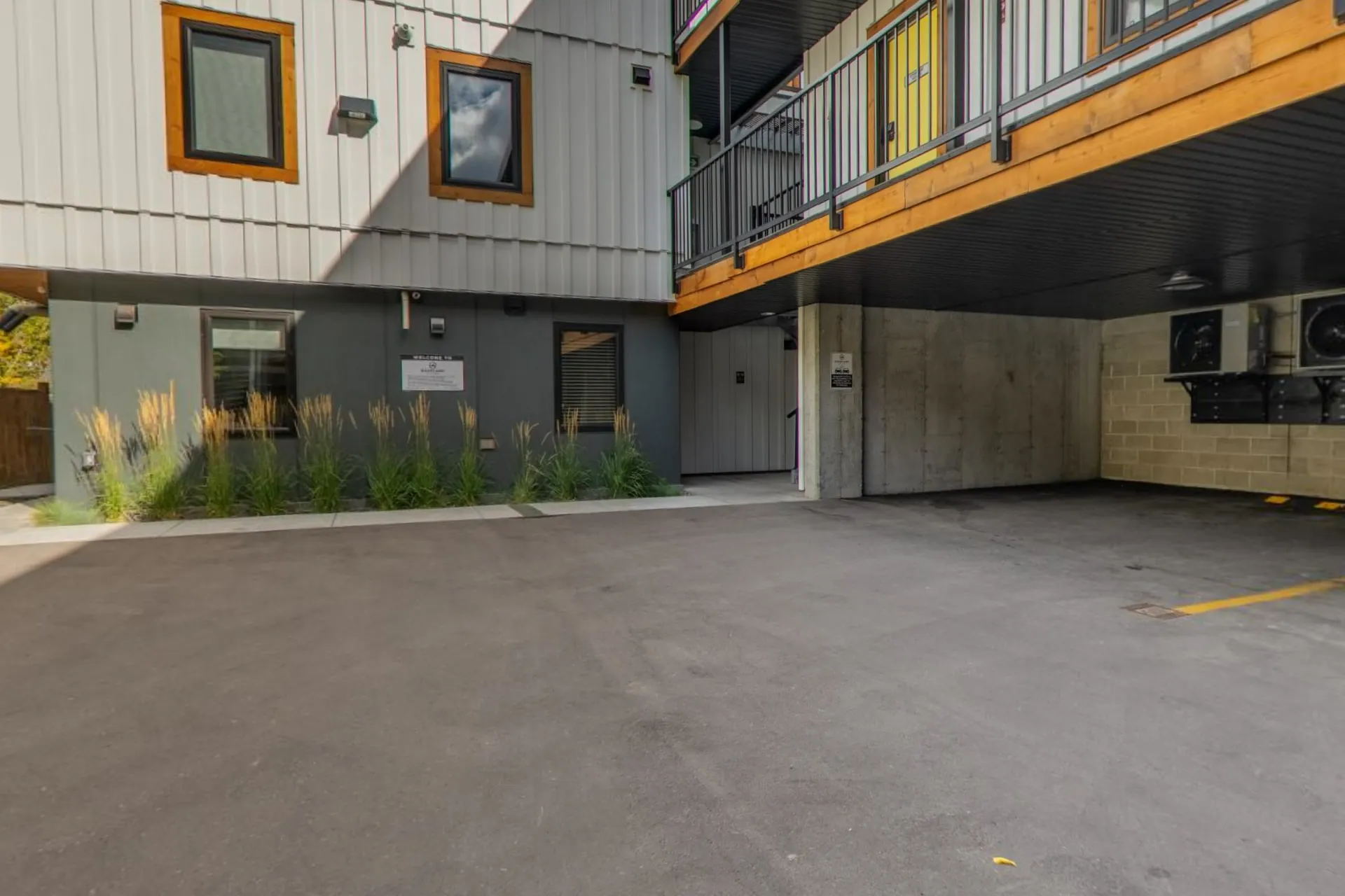 The courtyard and covered parking under the suites