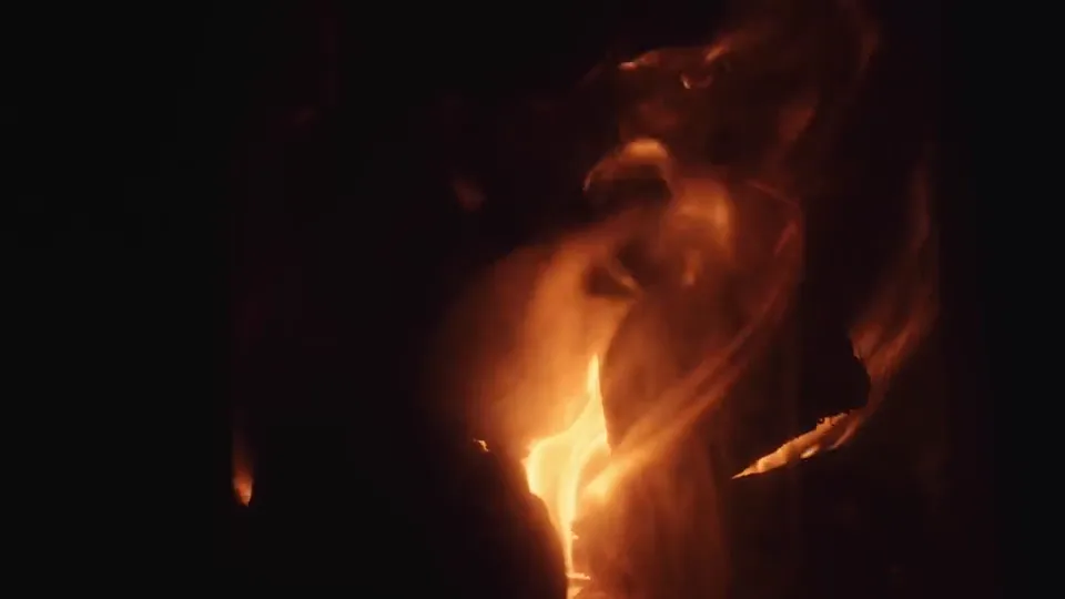 Flames close up in the campfire after dark